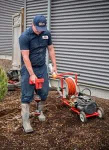 A picture of a Super Plumber team member providing drainage service